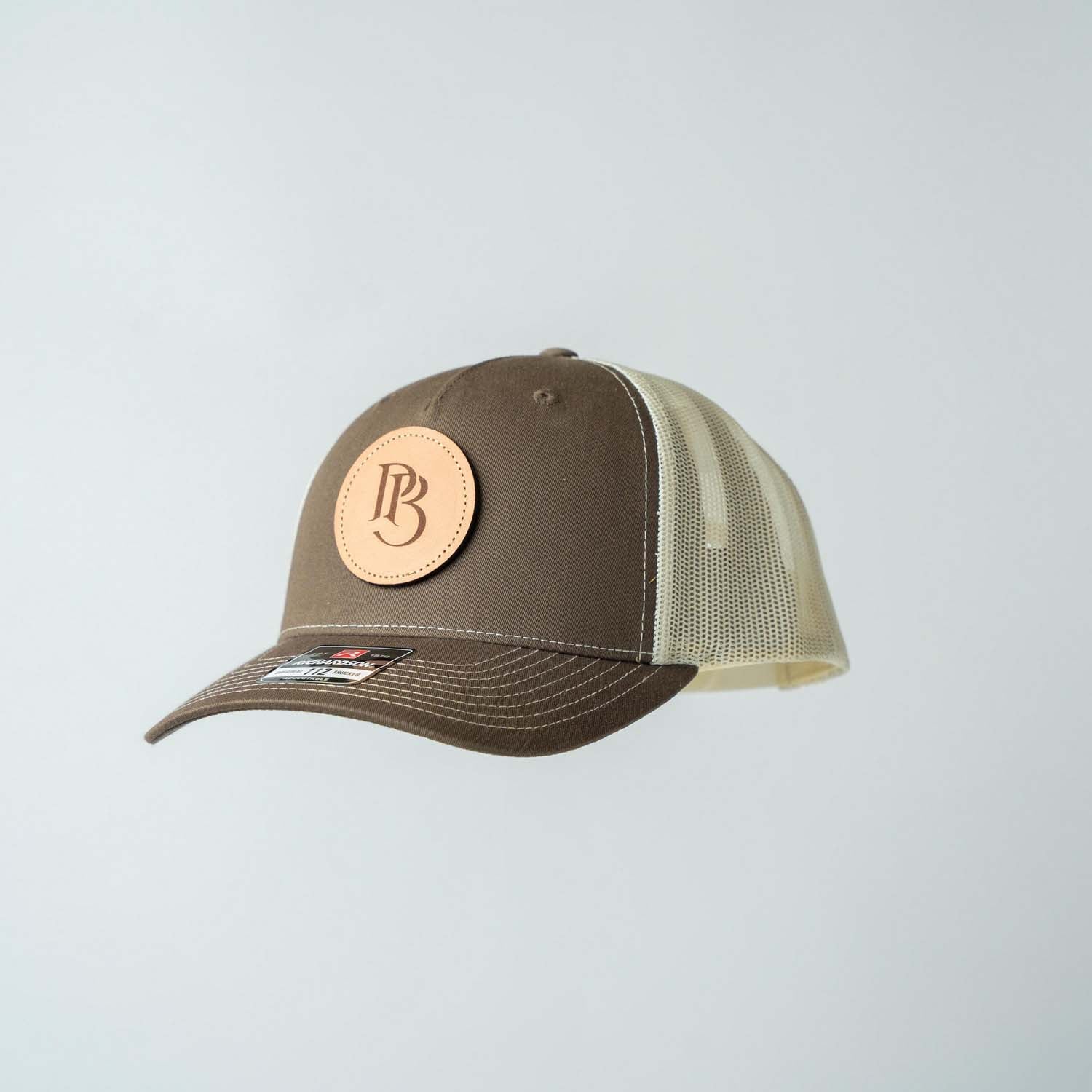 Trucker Hat | Chocolate Chip & Burch | Circular Monogram Logo Patch